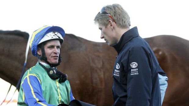 No comment: Luke Nolen chats with stable representative Tom Bideoake yesterday.