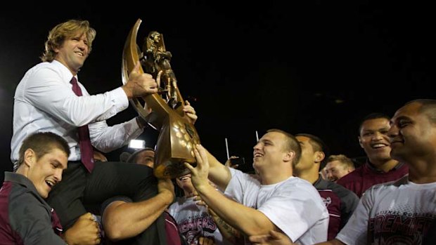 Before the storm ... Des Hasler and his Manly side celebrate their grand final win against the New Zealand Warriors last month.