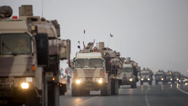 In this photo made available by the Emirates News Agency, WAM, a convoy of UAE military vehicles celebrate their return from active duty as part of the Saudi-led coalition in Yemen.