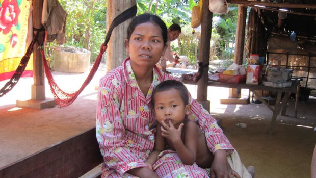 Cambodian maid Orn Eak, 28, with her  son Ho Bora, 5. Orn Eak was abused for almost two years by her Malaysian employer.