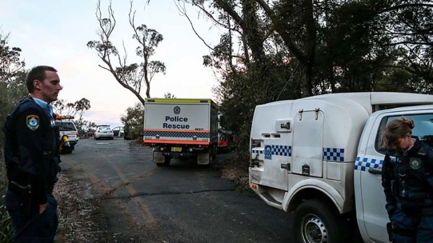 Police, forensic police and the SES at a crime scene established at Jamberoo lookout after the discovery of a body.