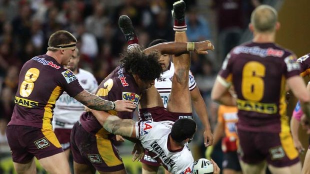 The moment ... Sam Thaiday's tackle on Brent Kite could be costly for the Broncos.