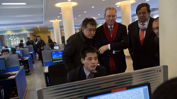 Executive Chairman of Google, Eric Schmidt, third from left, and former New Mexico governor Bill Richardson, second from right, watch as a North Korean student surfs the internet.