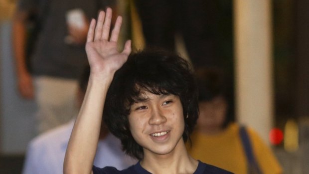 Found guilty: Amos Yee waves as he leaves court on Tuesday.