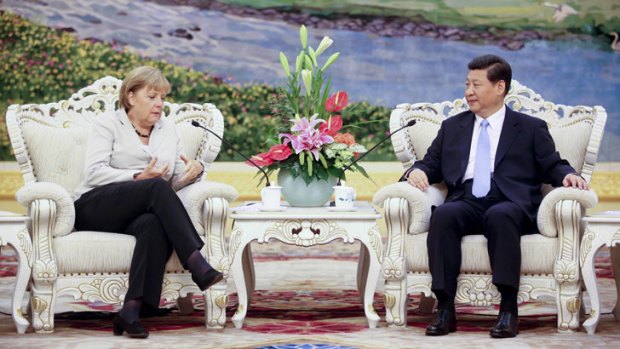 German Chancellor Angela Merkel meets Chinese Vice-President Xi Jinping, who has not been seen for eight days, in Beijing on August 30.