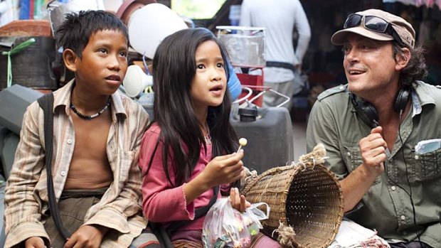 First-time feature: Director Kim Mordaunt with the stars of <i>The Rocket</i>, Sitthiphon "Ki" Disamoe as Ahlo, left, and Loungnam Kaosainam, centre, as Kia.  