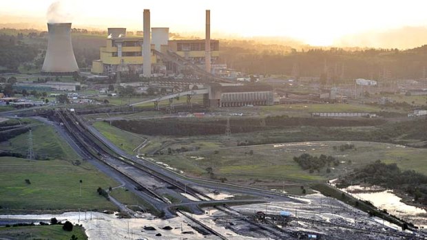 The flooded Yallourn open cut mine, with the power station in the background.