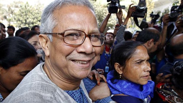 Losing the battle ... Muhammad Yunus on his way to court to try to reverse the order to dismiss him as head of Grameen Bank.