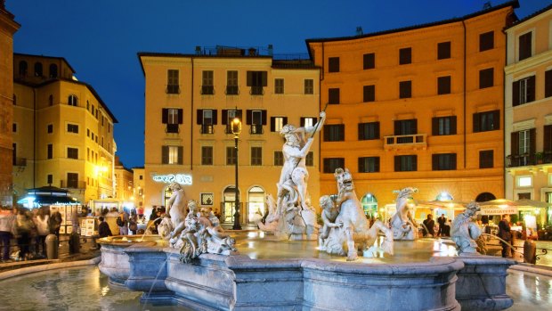 Piazza Navona's fountain at night, one of the countless delights of Rome.