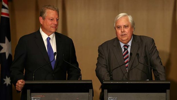 Clive Palmer, joined by former US vice-president Al Gore, has declared his vote to repeal the carbon tax will be contingent upon the government mandating that savings from lower energy costs are passed on to households.