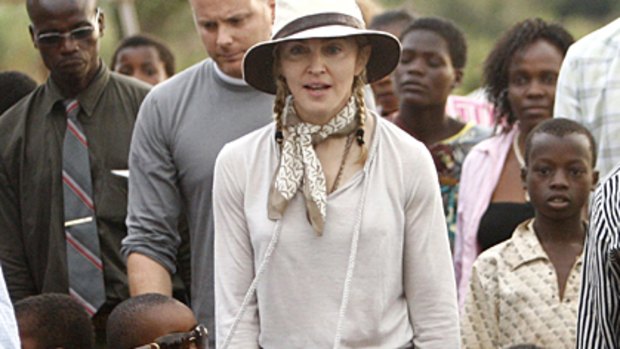 Madonna with her adopted children David and Mercy at the Mphandula Child Care Centre west of Lilongwe, Malawi, yesterday.