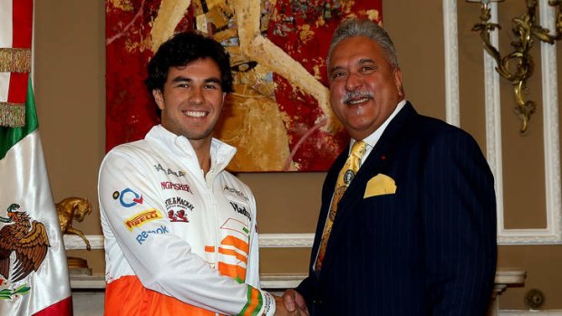 Sahara Force India Team Principle Vijay Mallya (right) welcomes Sergio Perez as their new driver.