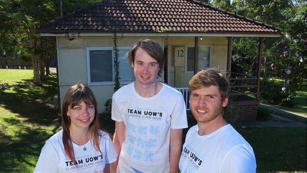 Environmental makeover: Lloyd Niccol, right, and fellow Wollongong students in front of a fibro house that they are environmentally retro fitting.