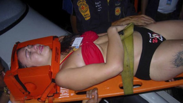 Rescue ... an unidentified partygoer receives medical help.