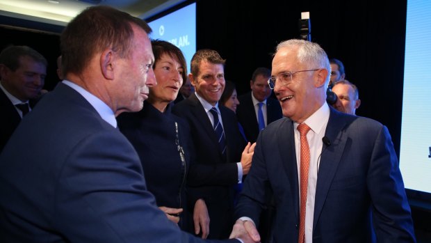 Prime Minister Malcolm Turnbull with Tony Abbott after he addressed the Coalition national campaign rally in Homebush on Sunday.