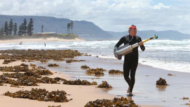 Pull factor: Dr Rob Brander mapping the currents of rips at Bulli beach.