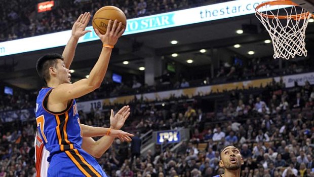 A star is born  ... New York Knicks guard Jeremy Lin goes up for a basket.