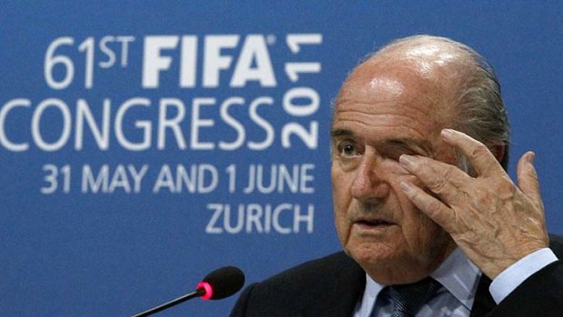 Sepp Blatter addresses a news conference after being re-elected for a fourth term.