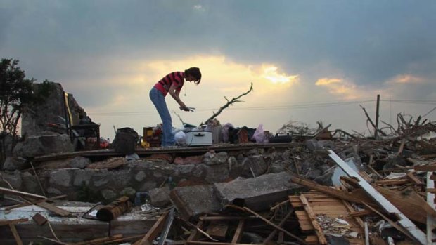 Barack Obama returned to the US to face the devastation that ripped through Joplin.