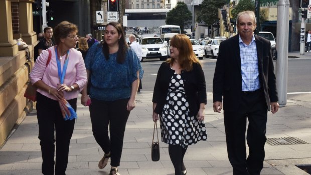 Liz Noble, far left, and Ross Noble, far right, parents of Chris Noble who was killed in an explosion in Rozelle, arrive at the NSW Supreme Court on Thursday.