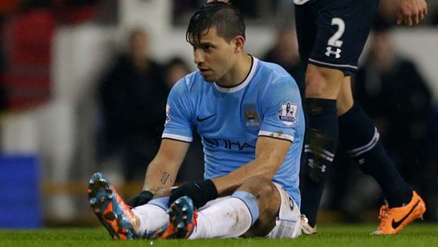 Manchester City's Sergio Aguero sits on the field injured before being substituted during the match against Tottenham Hotspur last Wednesday.