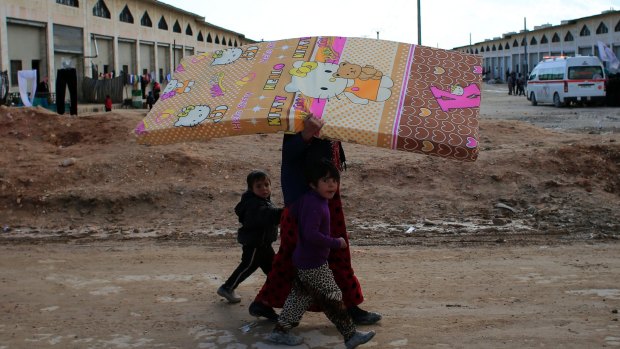 A Syrian woman displaced with her family from eastern Aleppo. 