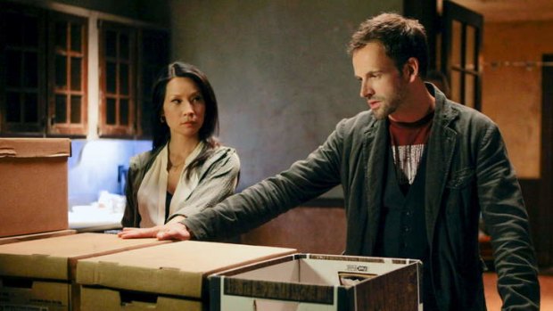 Lucy Liu (Watson) and Jonny Lee Miller (Holmes) update the detective's legend in <i>Elementary</i>.