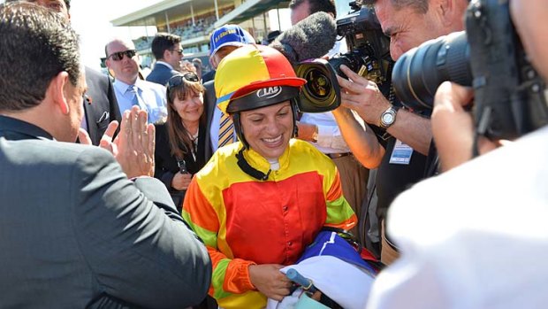 It's a miracle: Lauren Stojakovic is mobbed after winning the Blue Diamond on Saturday.