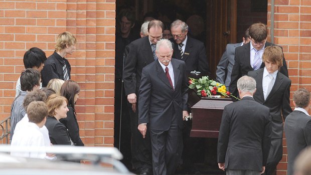 Pall bearers carry Justin Galligan's casket at his 2008 funeral.