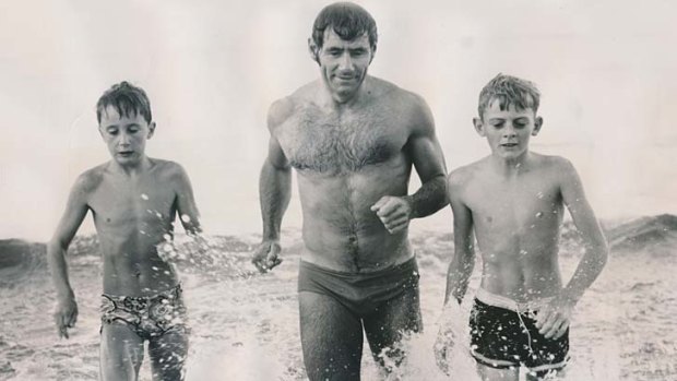 A fitness fanatic into his 80s, Tommy Hafey takes a swim at Mentone, flanked by Richmond supporters Jim Harrington (left) and Adam Smith, in 1970.