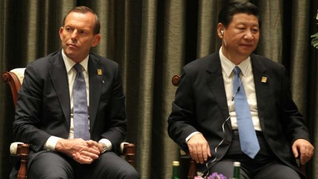 Sideline chat: Tony Abbott and President Xi Jinping.
