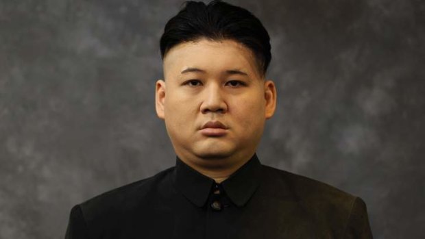 Australian Howard, 34, who does not disclose his last name, poses after having a haircut and make-up applied to turn himself into a North Korean leader Kim Jong-un lookalike at a hair salon in Hong Kong.