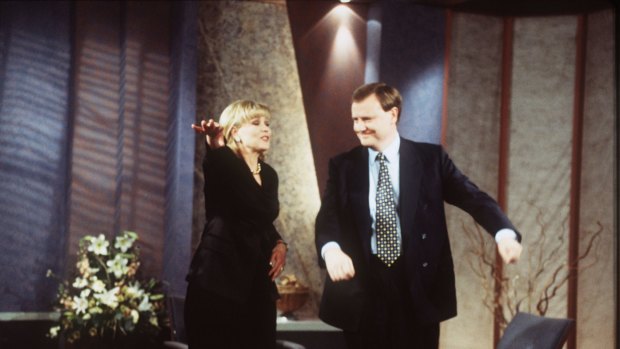 Former treasurer and current Nine chairman, Peter Costello, does the macarena with Kerri-Anne Kennerley in 1996. 