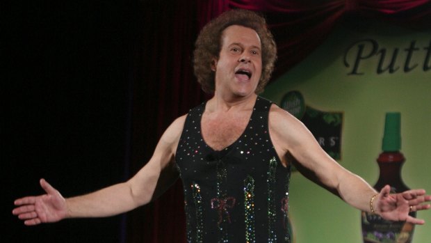 Richard Simmons speaks to the audience before the start of a summer salad fashion show at Grand Central Terminal in New York in 2006.