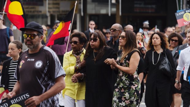 Mourners march through Redfern ahead of the state funeral for activist Sol Bellear.