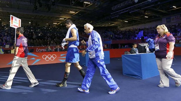 Iran's Ali Mazaheri leaves the ring after being disqualified.