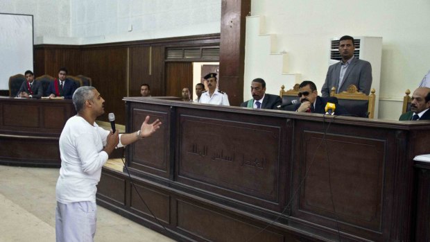 Mohamed Fahmy talks to the judge in May last year.