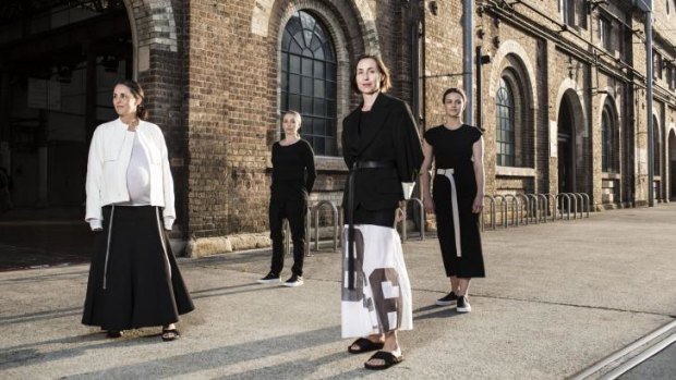 Designers Mary Lou Ryan and Deborah Sams, of Sydney's bassike, front, with Carriageworks staff in their new uniforms.