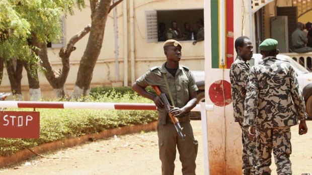 Mali soldiers stand their guard in Bamako.