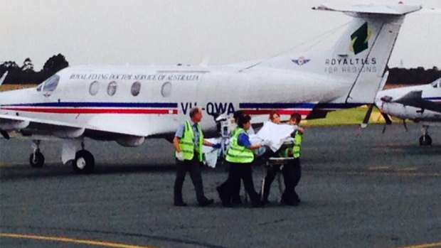 Shark attack victim Greg Pickering at Jandakot Airport, on his way to hospital in Perth.