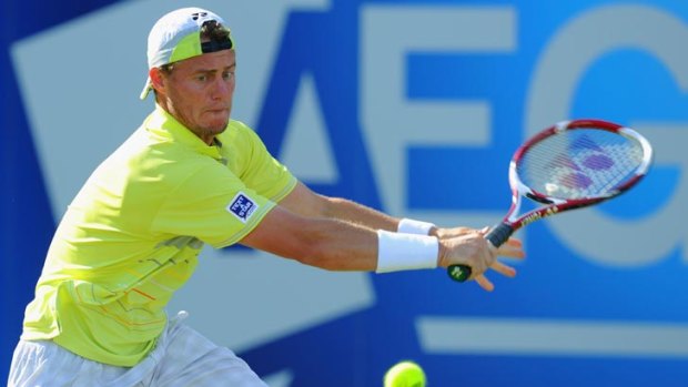 Lleyton Hewitt in action in the first round of the AEGON International at Eastbourne, England. He was forced to retire injured when a set down against Belgian Olivier Rochus.