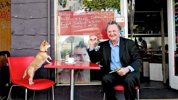 Satirical engagement: Louis Nowra, winner of the Patrick White Literary Award, having coffee in Kings Cross with his chihuahua Coco.