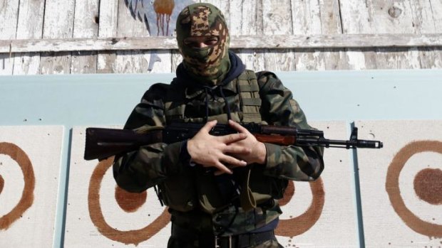A Young pro-Russian rebel stands in front of shooting targets after training in the town of Donetsk, eastern Ukraine.