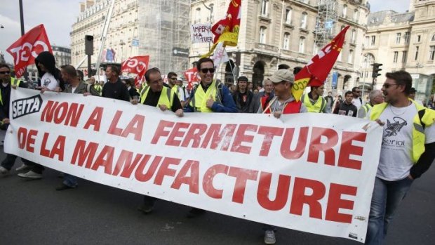A march in Paris: French workers fight plans to deregulate industries.