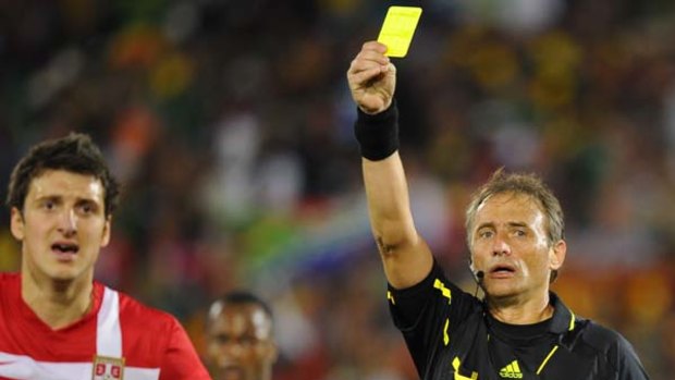 Sorry ... Serbia's  Zdravko Kuzmanovic is given a yellow card after Argentinian referee Hector Baldassi awarded a penalty.