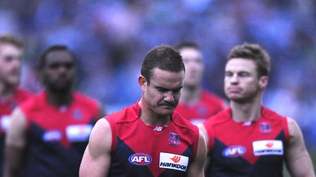 Dee-saster: Skipper Brad Green leads off his Demons after the Skilled Stadium slaughter.