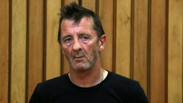 In the dock: Phil Rudd appears late for court.