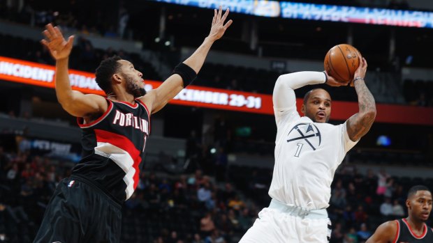 Pass master: Denver Nuggets guard Jameer Nelson looks to pass as he drives the lane past Evan Turner.