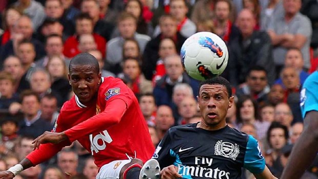 Ashley Young of Manchester United curls the ball and scores his side's second goal.
