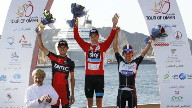 Overall winner Chris Froome of Britain, runner-up Tejay van Garderen and Rigoberto Uran celebrate on the podium after the Tour of Oman in Muscat.
